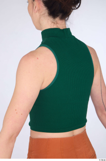 Zolzaya casual dressed green turtleneck sleeveless crop top upper body…